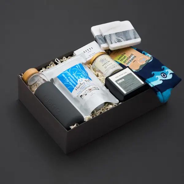 sustainable gift box with luxury products on black background
