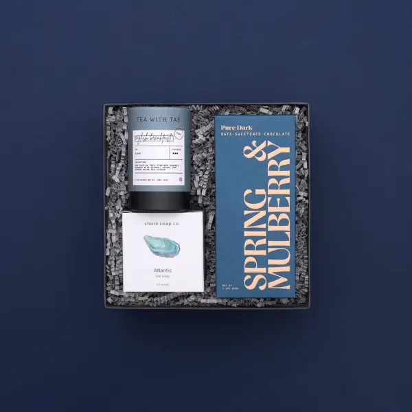 gift box full of small business products on blue background