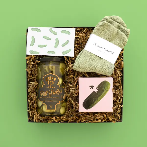 gift box with pickle products on a green background