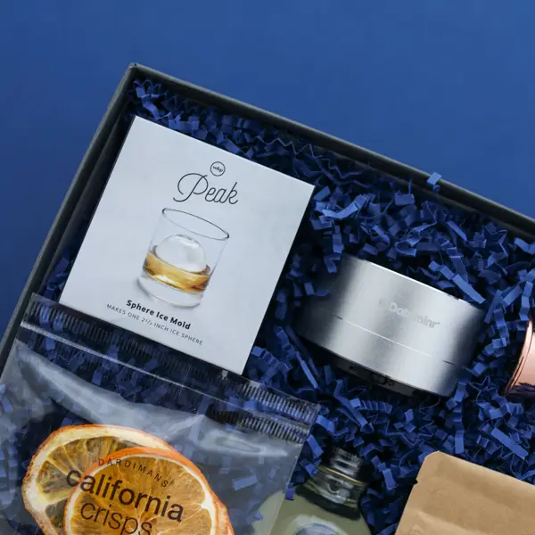 custom branded speaker inside a gift box on a blue background