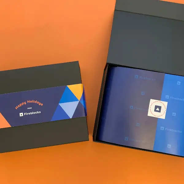 custom branded gift box packaging on an orange background