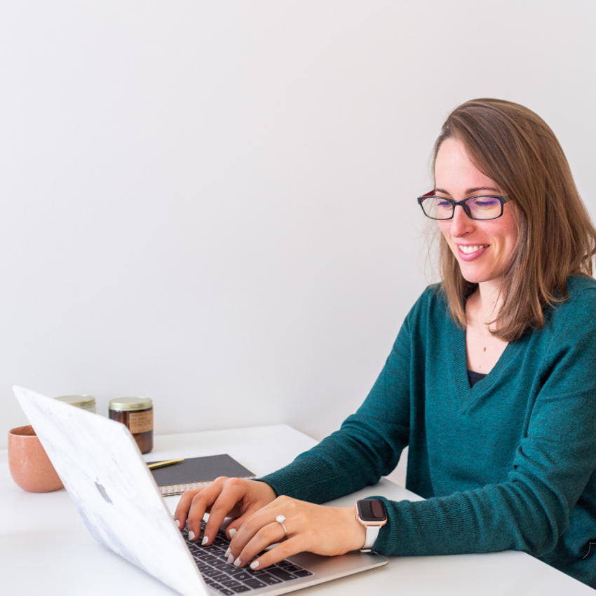 happy-woman-typing - Teak & Twine Happy Woman Typing